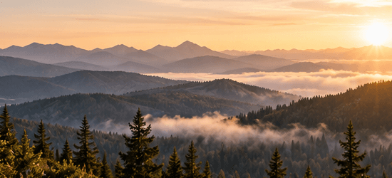 A quiet ridgeline at dawn with soft mist.
